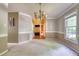 Inviting dining room with classic chandelier and views into other rooms at 203 Halls Mill Dr, Cary, NC 27519