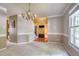 Charming dining room with neutral tones and seamless flow into other rooms at 203 Halls Mill Dr, Cary, NC 27519