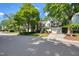 A well-maintained home with a manicured lawn and mature trees in a suburban neighborhood setting at 203 Halls Mill Dr, Cary, NC 27519