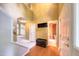 Spacious foyer with wood floors and access to a half bath and staircase at 203 Halls Mill Dr, Cary, NC 27519