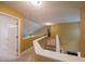 Upstairs landing featuring neutral paint and carpet and a staircase to the lower level at 203 Halls Mill Dr, Cary, NC 27519