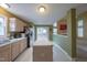 Well-lit kitchen featuring an island, stainless steel appliances, light cabinets, and a window over the sink at 203 Halls Mill Dr, Cary, NC 27519