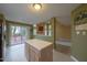 Kitchen area showing a view to the backyard deck and vaulted ceilings at 203 Halls Mill Dr, Cary, NC 27519