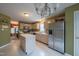 Kitchen with stainless steel appliances, center island, and plenty of cabinet space at 203 Halls Mill Dr, Cary, NC 27519