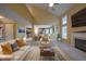Inviting living room features high ceilings, a fireplace, and seamless access to the adjacent kitchen at 203 Halls Mill Dr, Cary, NC 27519