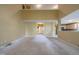 Open-concept living room with neutral colors, vaulted ceilings, and an open entryway at 203 Halls Mill Dr, Cary, NC 27519