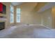 Bright and spacious living room featuring a fireplace and many large windows at 203 Halls Mill Dr, Cary, NC 27519