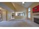 Open floor plan with a bright living room featuring a fireplace and kitchen view at 203 Halls Mill Dr, Cary, NC 27519
