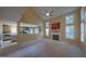 Bright living room with a fireplace, multiple windows, and view to the kitchen at 203 Halls Mill Dr, Cary, NC 27519
