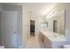 Main bathroom featuring a double sink vanity and access to a walk-in closet at 203 Halls Mill Dr, Cary, NC 27519