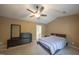 Comfortable main bedroom with neutral carpet, ceiling fan, and modern furnishings at 203 Halls Mill Dr, Cary, NC 27519