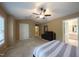 Spacious main bedroom featuring a ceiling fan, ensuite bathroom access, and a walk-in closet at 203 Halls Mill Dr, Cary, NC 27519