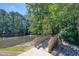Picturesque pond with a wooden bridge and fountain, surrounded by lush trees at 203 Halls Mill Dr, Cary, NC 27519