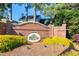 Community signage with a brick wall, shrubbery, and landscaping at 203 Halls Mill Dr, Cary, NC 27519
