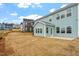 Backyard featuring a spacious lawn and the exterior of the house at 219 Berry Mill Ln # 179, Raleigh, NC 27603