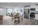 Open-concept living space with a modern kitchen, cozy living area, and stylish furnishings at 222 Rosewood Dr, Sanford, NC 27330