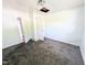 Bedroom featuring carpeted floors, access to the hallway and some ceiling damage at 2309 Chautauqua Ave, Durham, NC 27707