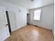 Simple bedroom with hardwood floors and a closet at 2309 Chautauqua Ave, Durham, NC 27707