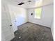 Bright bedroom with some damage to the ceiling, and a window at 2309 Chautauqua Ave, Durham, NC 27707