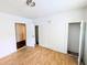 Bedroom featuring hardwood floors, a closet, and natural light at 2309 Chautauqua Ave, Durham, NC 27707