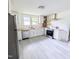 Bright kitchen features stainless steel appliances, ample counter space, and clean white cabinets at 2309 Chautauqua Ave, Durham, NC 27707