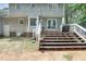 A great outdoor deck features a staircase, perfect for outdoor relaxation and entertainment at 2312 Brasswynd Ct, Fuquay Varina, NC 27526