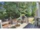 A charming backyard deck set up for outdoor entertaining and relaxation at 2312 Brasswynd Ct, Fuquay Varina, NC 27526