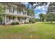 Charming two-story home with a well-manicured lawn and inviting front porch at 2312 Brasswynd Ct, Fuquay Varina, NC 27526