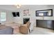 Cozy living room showcasing a fireplace, mounted TV, and comfortable furnishings at 2312 Brasswynd Ct, Fuquay Varina, NC 27526