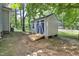 Storage shed with an access ramp in a fenced backyard at 2312 Brasswynd Ct, Fuquay Varina, NC 27526