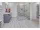 Bathroom featuring glass enclosed shower and double sink vanity with gray cabinets at 2371 Old Us 421, Lillington, NC 27546