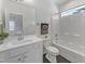 Bright bathroom featuring a white vanity, modern fixtures, and a shower-tub combination at 2371 Old Us 421, Lillington, NC 27546