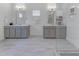 Bathroom featuring double sink vanity, tile flooring, and glass-enclosed shower at 2371 Old Us 421, Lillington, NC 27546