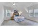Bedroom featuring a cozy bed with a soft carpet, ceiling fan, and natural light at 2371 Old Us 421, Lillington, NC 27546