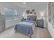 Bedroom with soft carpet, ceiling fan, and two bedside tables with lamps at 2371 Old Us 421, Lillington, NC 27546