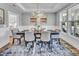 Traditional dining room with decorative chandelier, and large windows for ample natural light at 2371 Old Us 421, Lillington, NC 27546