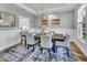 Spacious dining room featuring modern chandelier, muted color scheme, and natural light at 2371 Old Us 421, Lillington, NC 27546