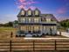 Stunning two-story home with a classic design, complemented by a neatly landscaped yard and inviting curb appeal at 2371 Old Us 421, Lillington, NC 27546