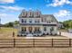 Beautiful white two-story home with a dark metal porch roof and a charming front yard at 2371 Old Us 421, Lillington, NC 27546