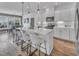 Modern kitchen featuring white cabinets, quartz countertops, a large island, and stainless steel appliances at 2371 Old Us 421, Lillington, NC 27546