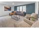Spacious living room with a comfortable gray sectional, stylish decor, and plenty of natural light at 2371 Old Us 421, Lillington, NC 27546