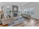 Bright living room with a fireplace feature, neutral decor, and hardwood floors, creating a cozy atmosphere at 2371 Old Us 421, Lillington, NC 27546