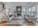 Bright living room with a fireplace feature, neutral decor, and hardwood floors, creating a cozy atmosphere at 2371 Old Us 421, Lillington, NC 27546