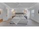 Bright main bedroom with soft carpet, ceiling fan, tray ceiling, and bedside tables with lamps at 2371 Old Us 421, Lillington, NC 27546