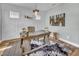 Bright home office features a rustic wooden desk with unique wall decor and accents at 2371 Old Us 421, Lillington, NC 27546