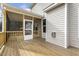 Back porch featuring wood flooring, wood railing, and view of backyard and home exterior at 25 Long Needle Ct # 37, Youngsville, NC 27596