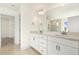Primary bathroom features a double vanity, large mirror, and a glass-enclosed shower at 25 Long Needle Ct # 37, Youngsville, NC 27596