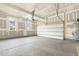 Spacious two-car garage featuring a garage door and two windows providing natural light at 25 Long Needle Ct # 37, Youngsville, NC 27596