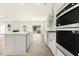 Open concept kitchen features stainless appliances and center island with a sink at 25 Long Needle Ct # 37, Youngsville, NC 27596