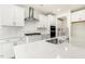 Modern kitchen featuring a large island with sink and stainless steel appliances at 25 Long Needle Ct # 37, Youngsville, NC 27596